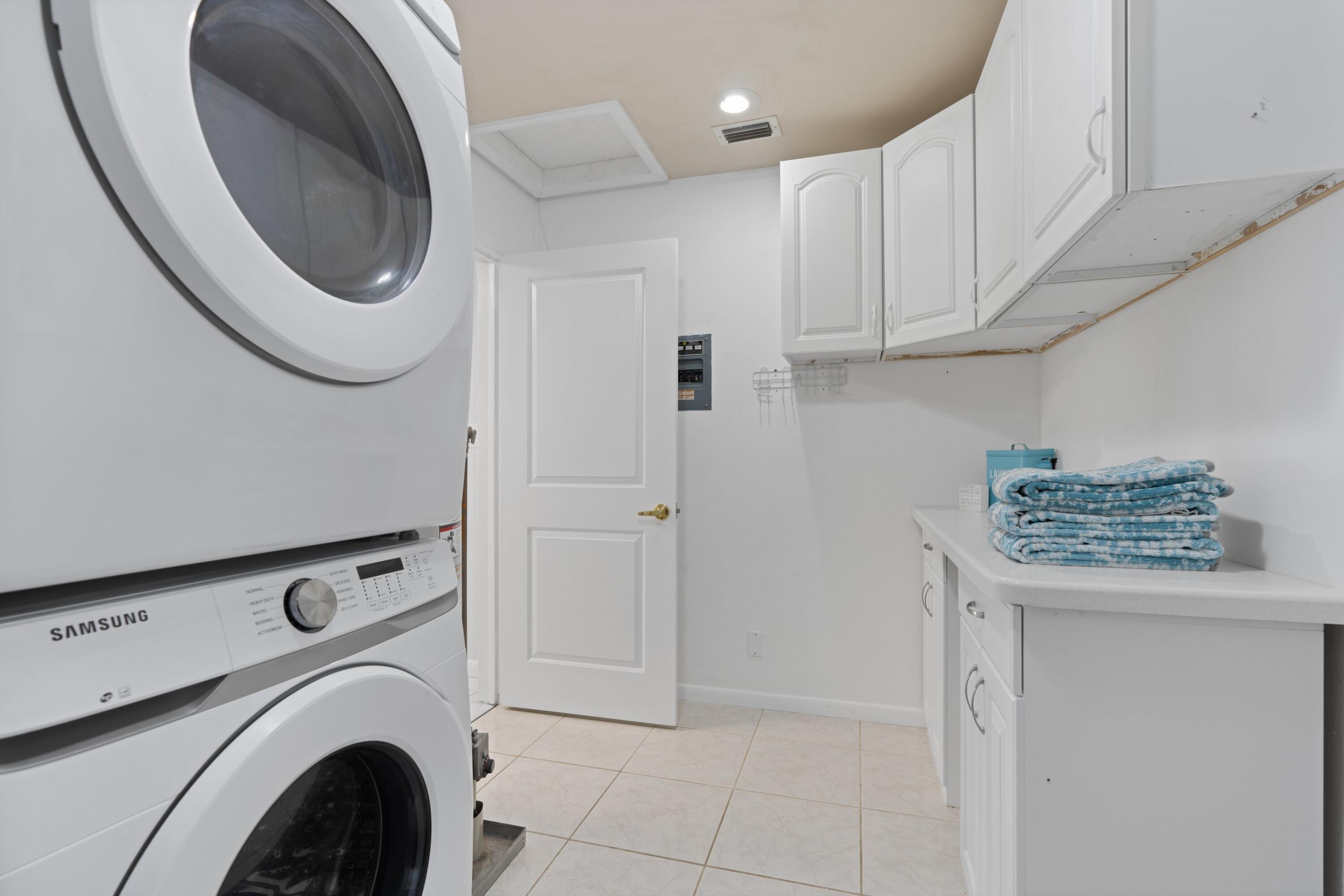 541 Kingfish Road North Palm Beach, FL 33408 - Photo 30 of 43 a view of a storage and utility room with washer and dryer