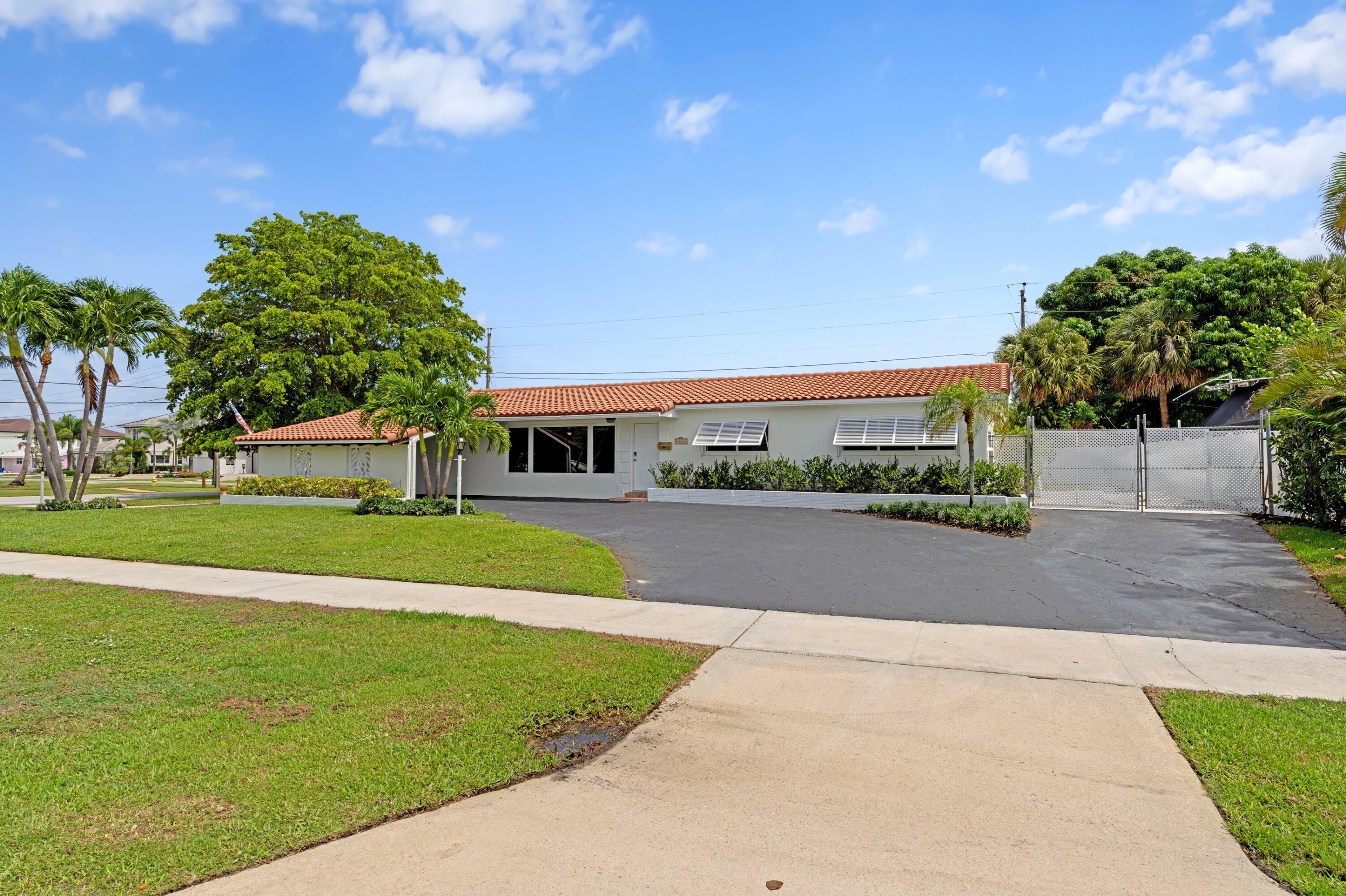 541 Kingfish Road North Palm Beach, FL 33408 - Photo 39 of 43 a view of building with outdoor space