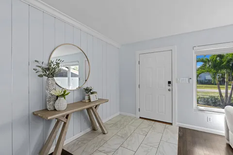 a view of a livingroom with furniture and wooden floor