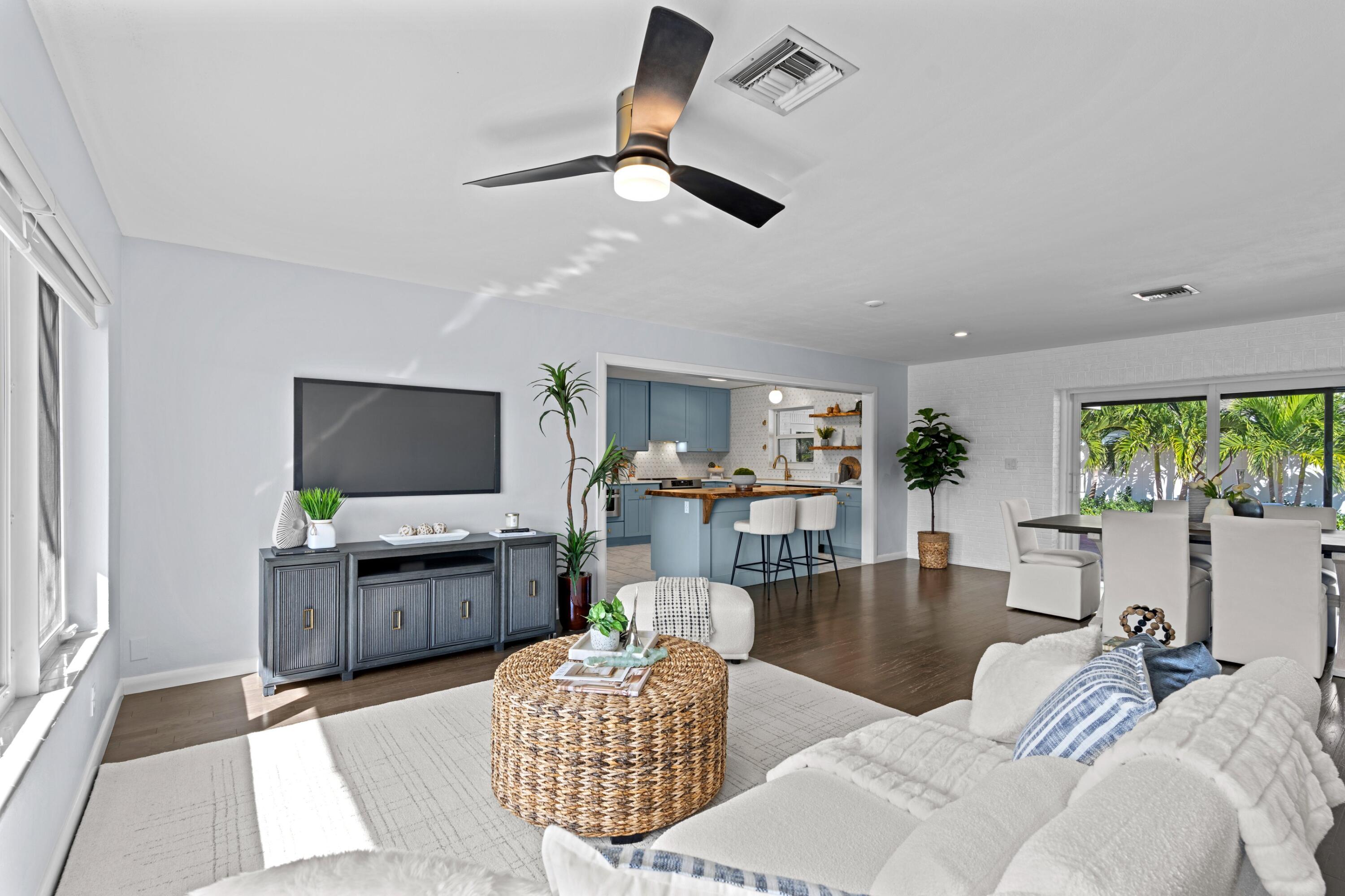 541 Kingfish Road North Palm Beach, FL 33408 - Photo 5 of 43 a living room with furniture and a flat screen tv
