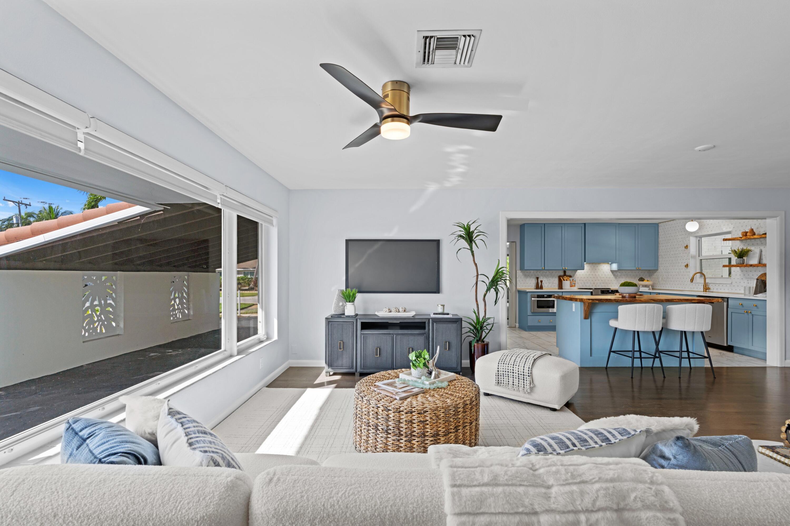 541 Kingfish Road North Palm Beach, FL 33408 - Photo 6 of 43 a living room with furniture and a flat screen tv