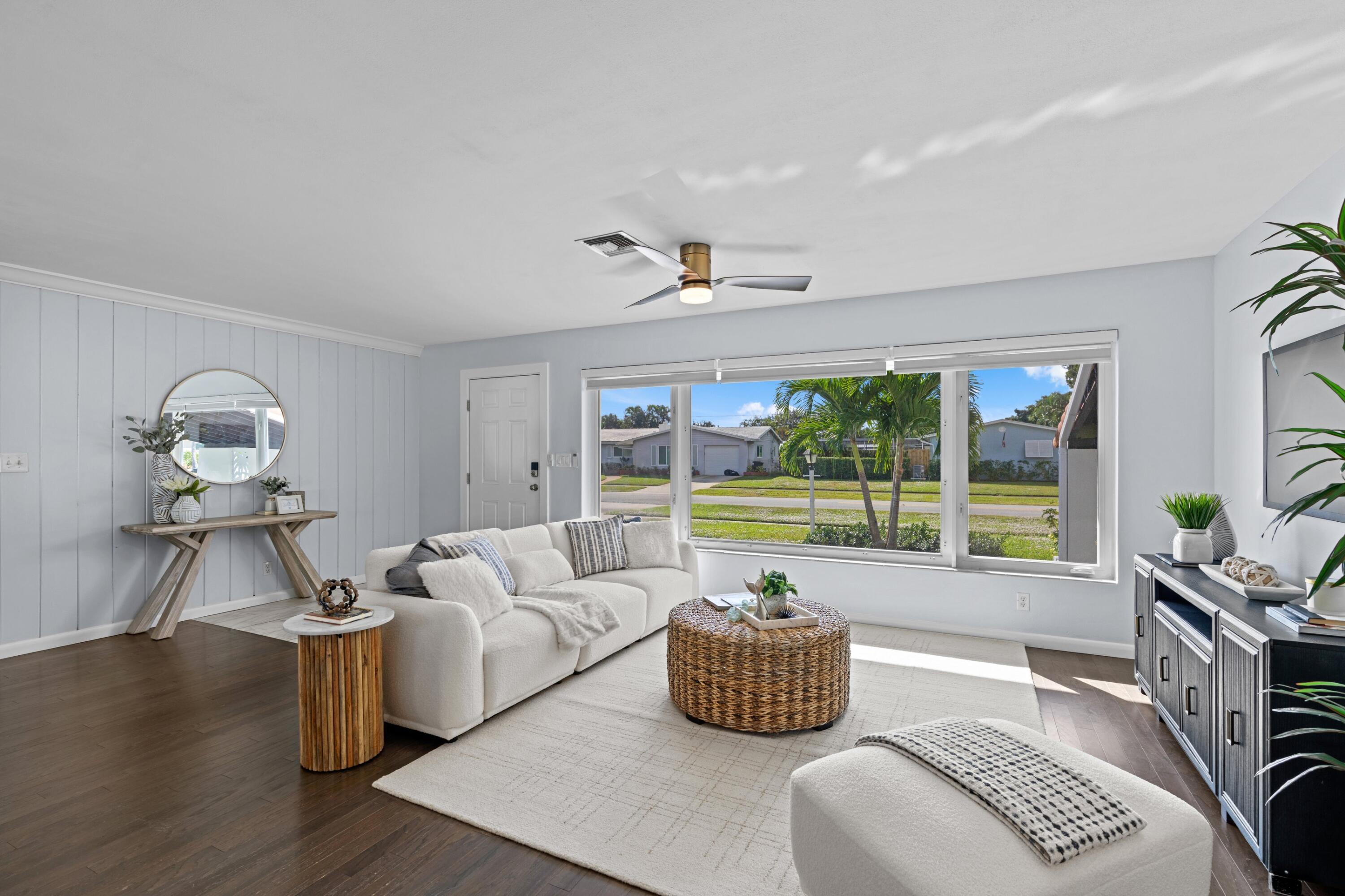 541 Kingfish Road North Palm Beach, FL 33408 - Photo 9 of 43 a living room with furniture and a large window