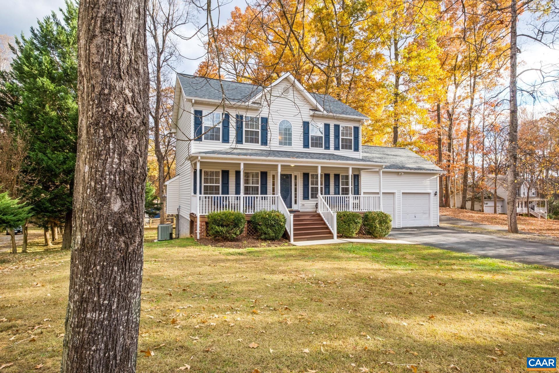 500 Northridge Road Ruckersville, VA 22968 - Photo 1 of 42 a front view of a house with a yard table and chairs