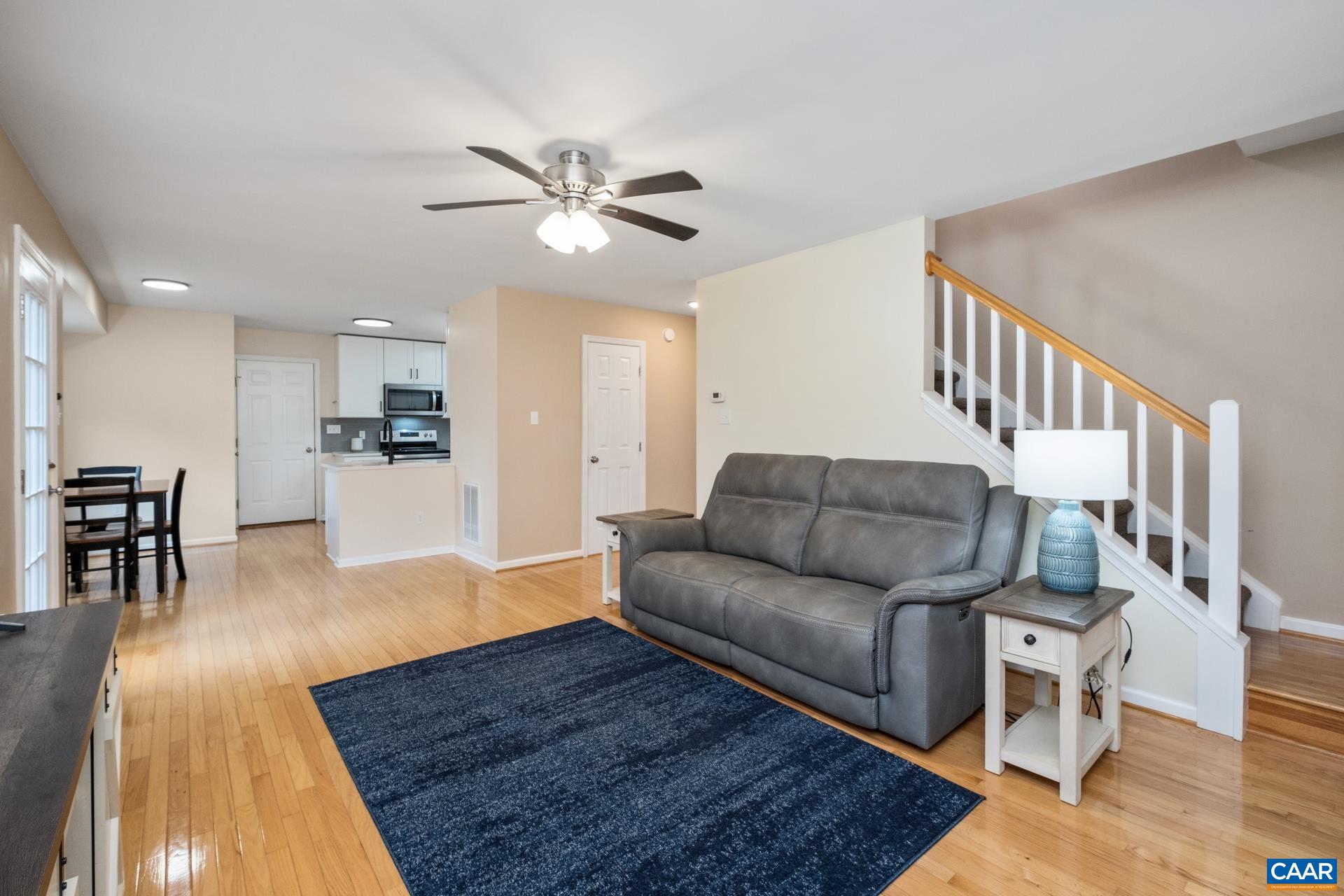 500 Northridge Road Ruckersville, VA 22968 - Photo 19 of 42 a living room with furniture wooden floor and a kitchen view