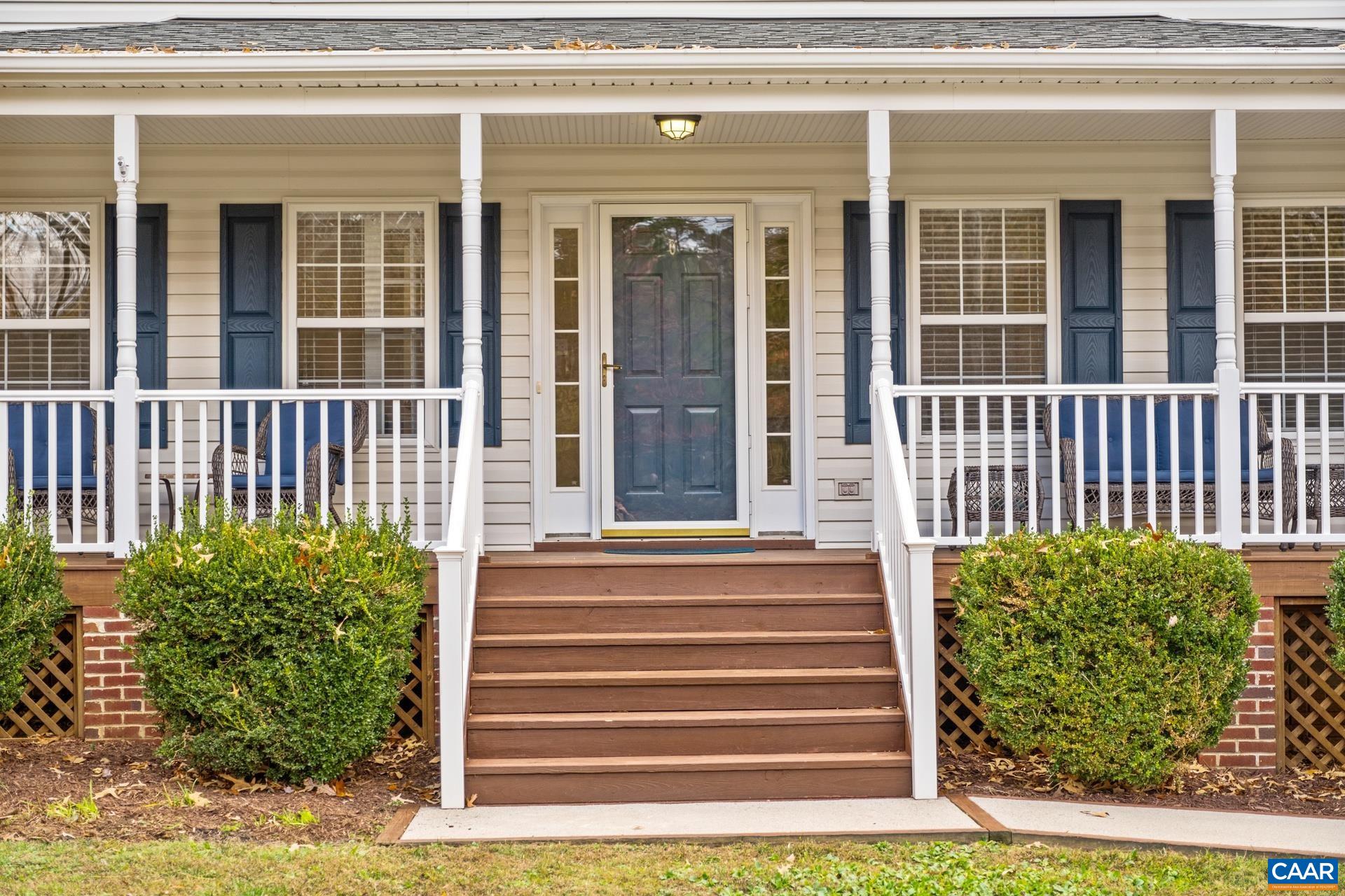 500 Northridge Road Ruckersville, VA 22968 - Photo 2 of 42 a front view of a house with a garden
