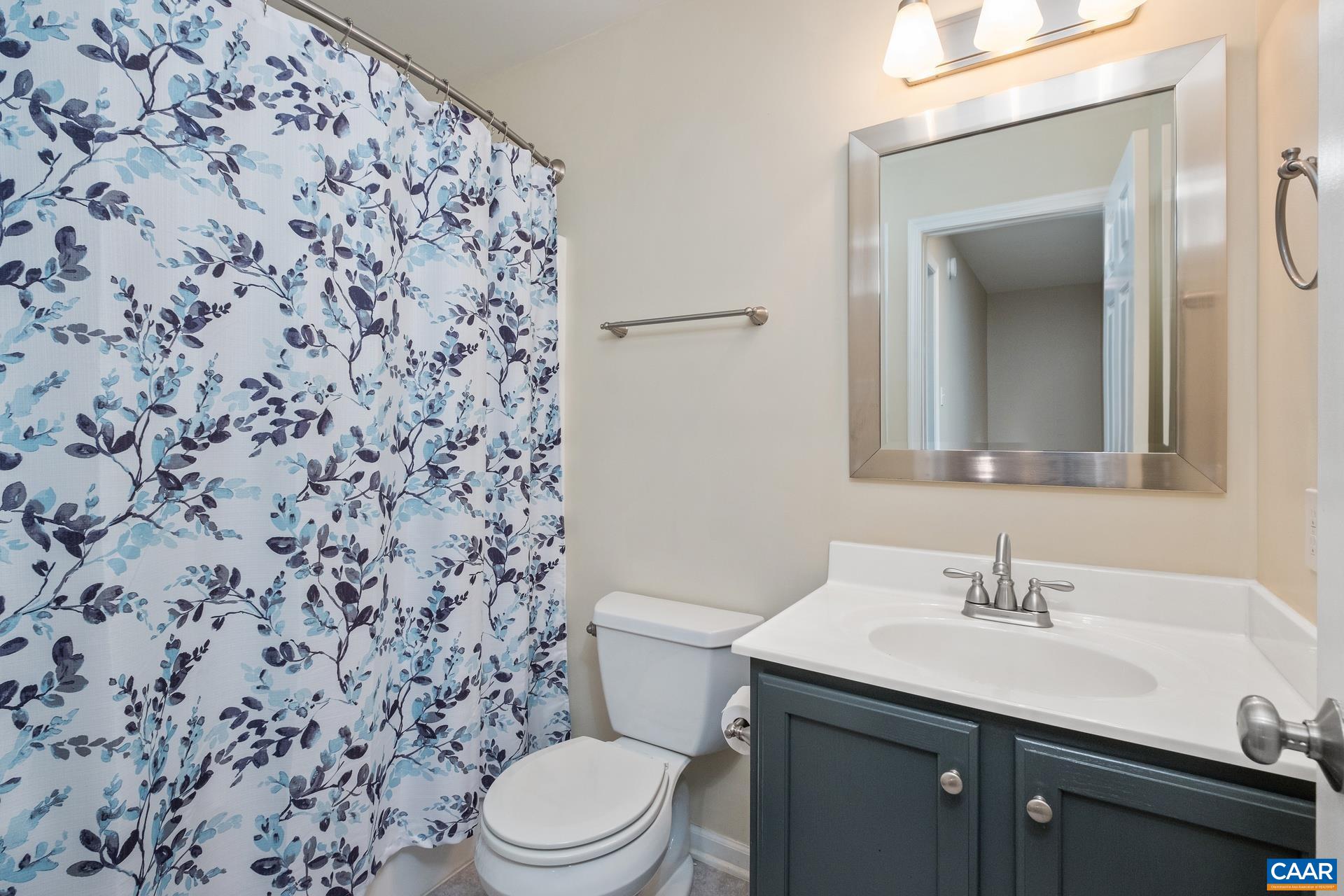 500 Northridge Road Ruckersville, VA 22968 - Photo 23 of 42 a bathroom with a sink toilet and mirror