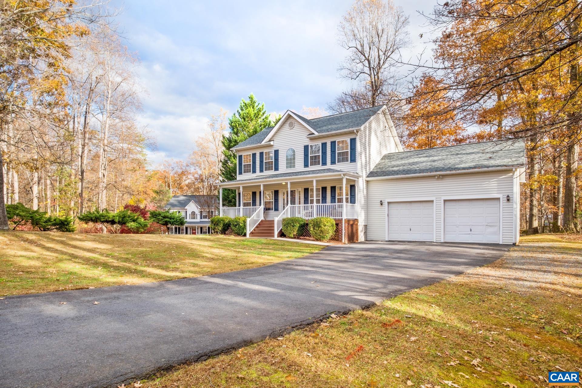 500 Northridge Road Ruckersville, VA 22968 - Photo 3 of 42 a view of a house with a big yard and large trees