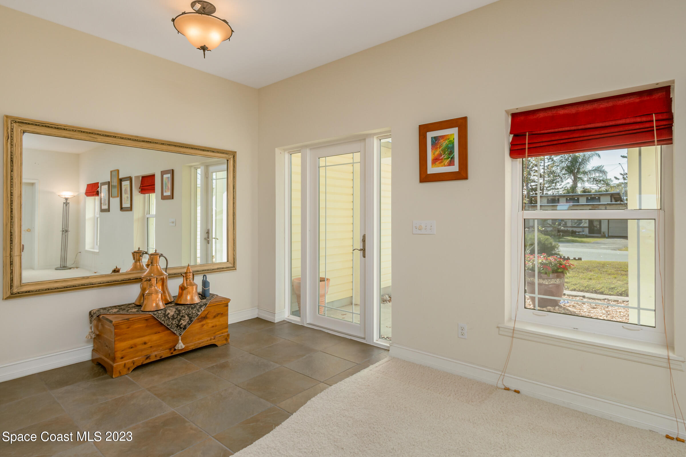 4553 Coquina Ridge Drive Melbourne, FL 32935 - Photo 11 of 51 a living room with furniture and a large window