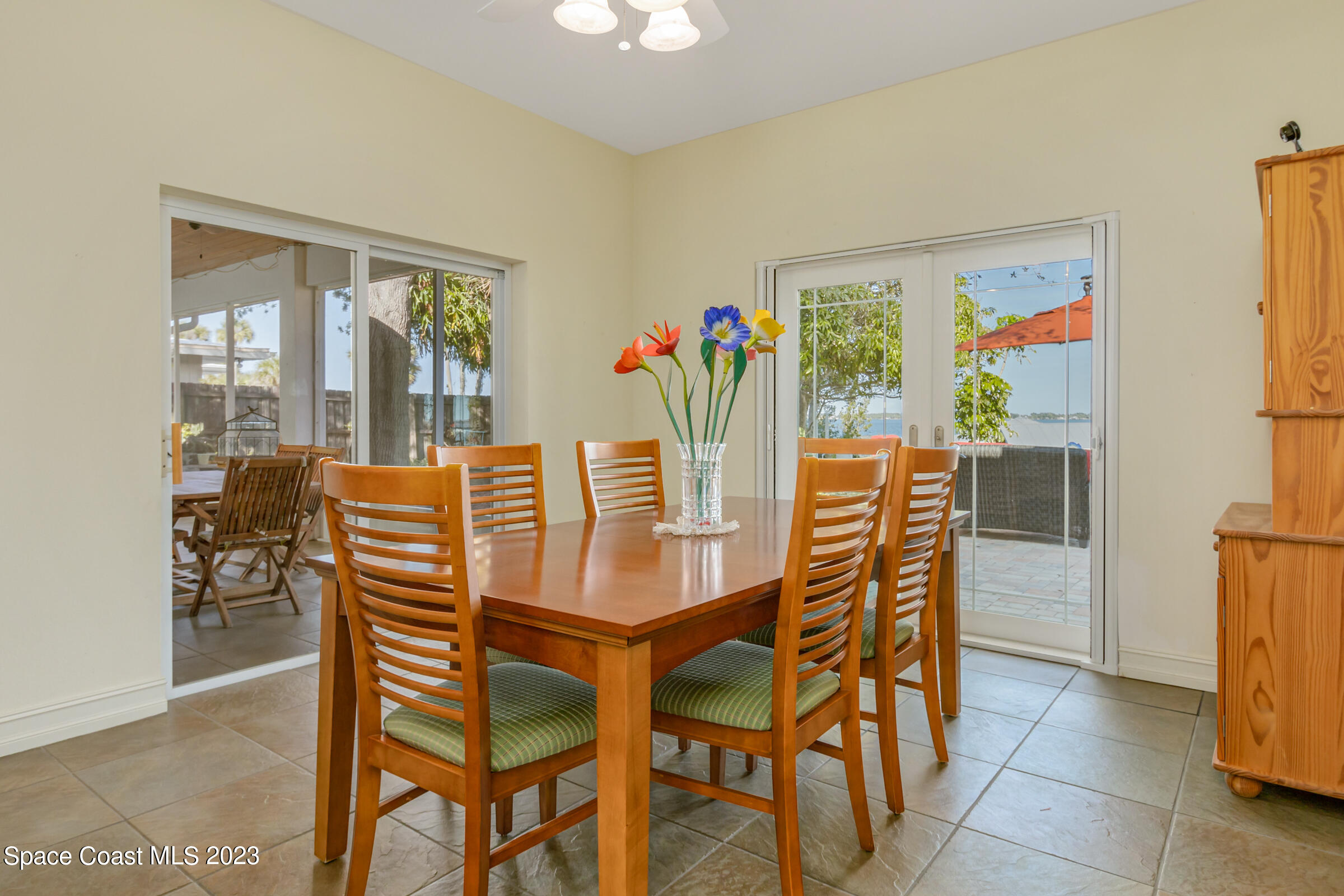 4553 Coquina Ridge Drive Melbourne, FL 32935 - Photo 15 of 51 a view of a dining room with furniture and a potted plant
