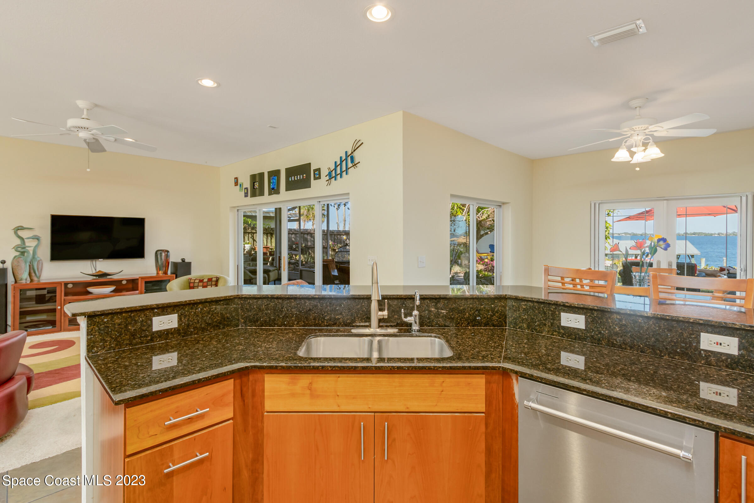 4553 Coquina Ridge Drive Melbourne, FL 32935 - Photo 18 of 51 a kitchen with granite countertop a sink and a stove