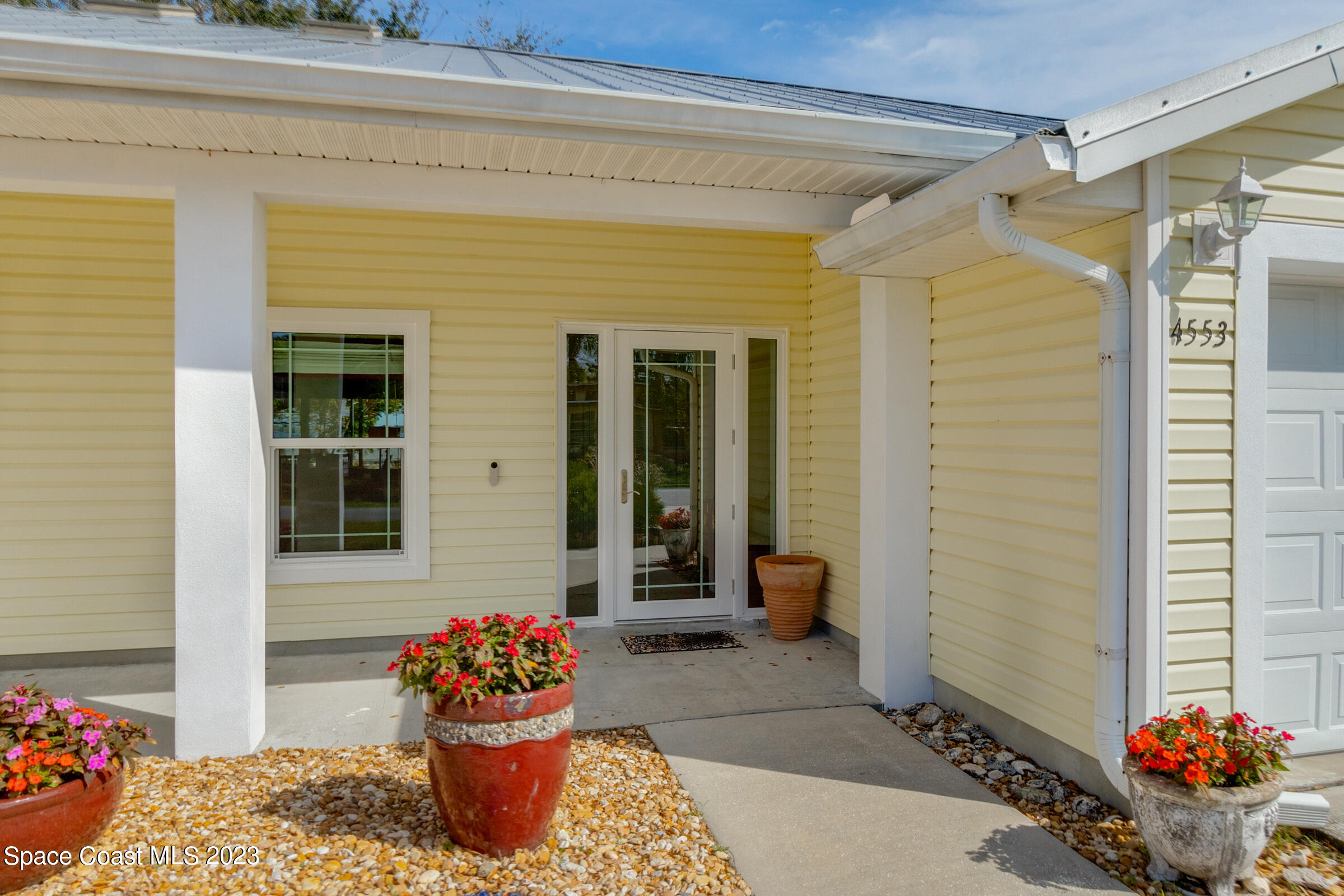 4553 Coquina Ridge Drive Melbourne, FL 32935 - Photo 20 of 51 a front view of a house