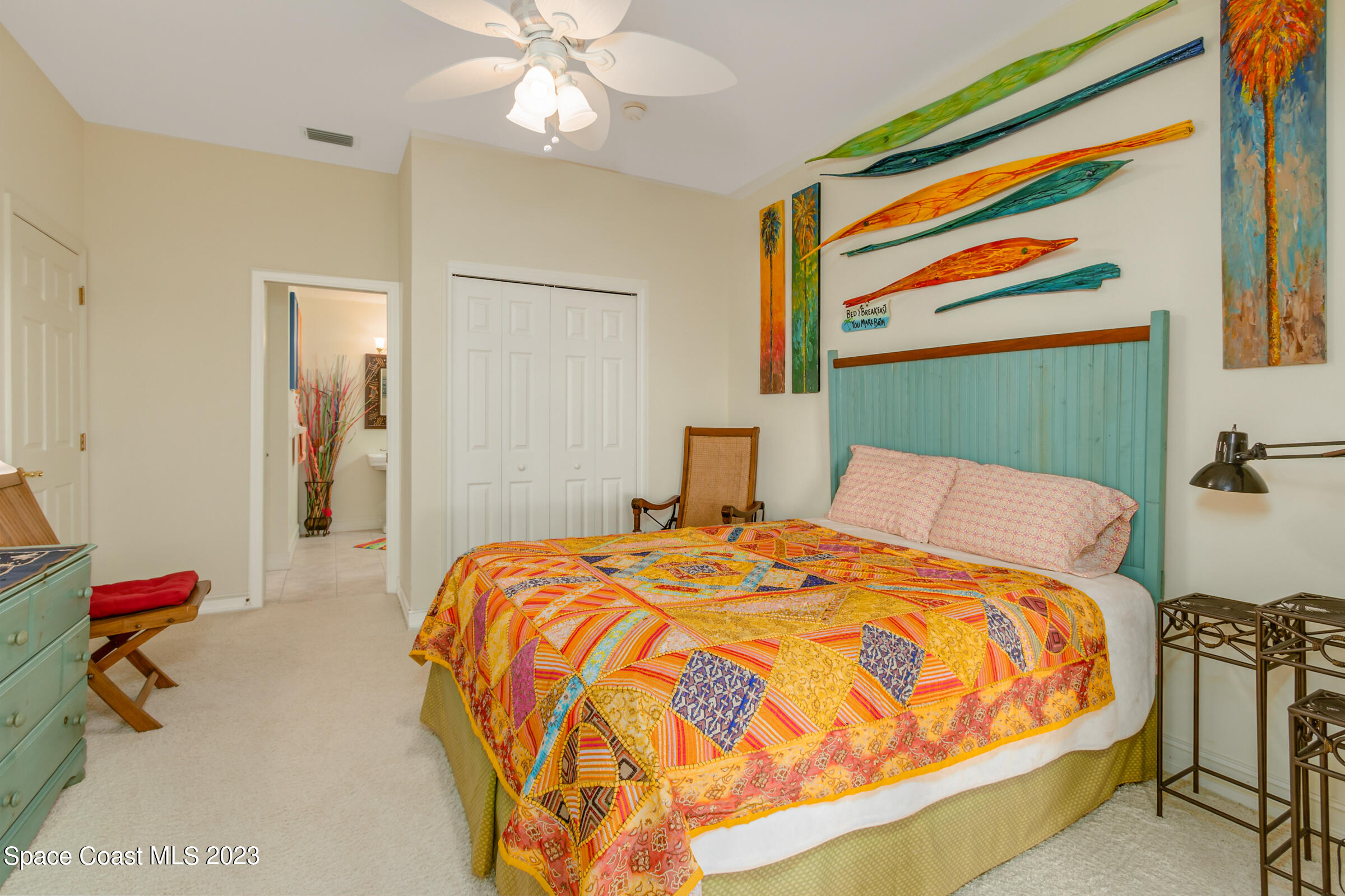 4553 Coquina Ridge Drive Melbourne, FL 32935 - Photo 25 of 51 a bedroom with a bed and dresser