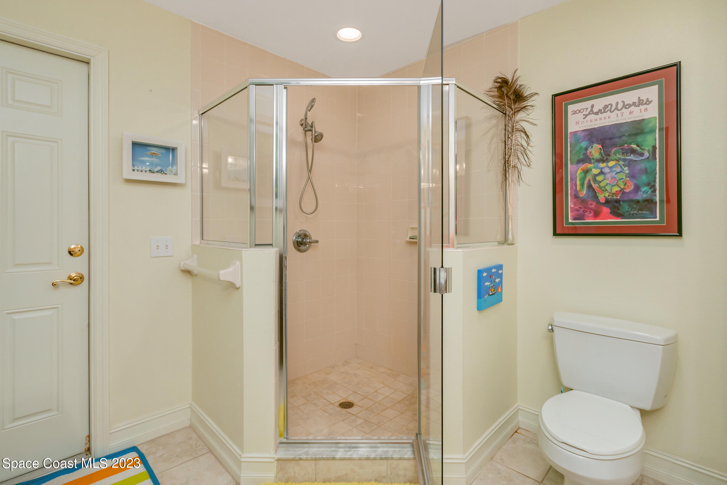4553 Coquina Ridge Drive Melbourne, FL 32935 - Photo 28 of 51 a bathroom with a shower toilet and sink