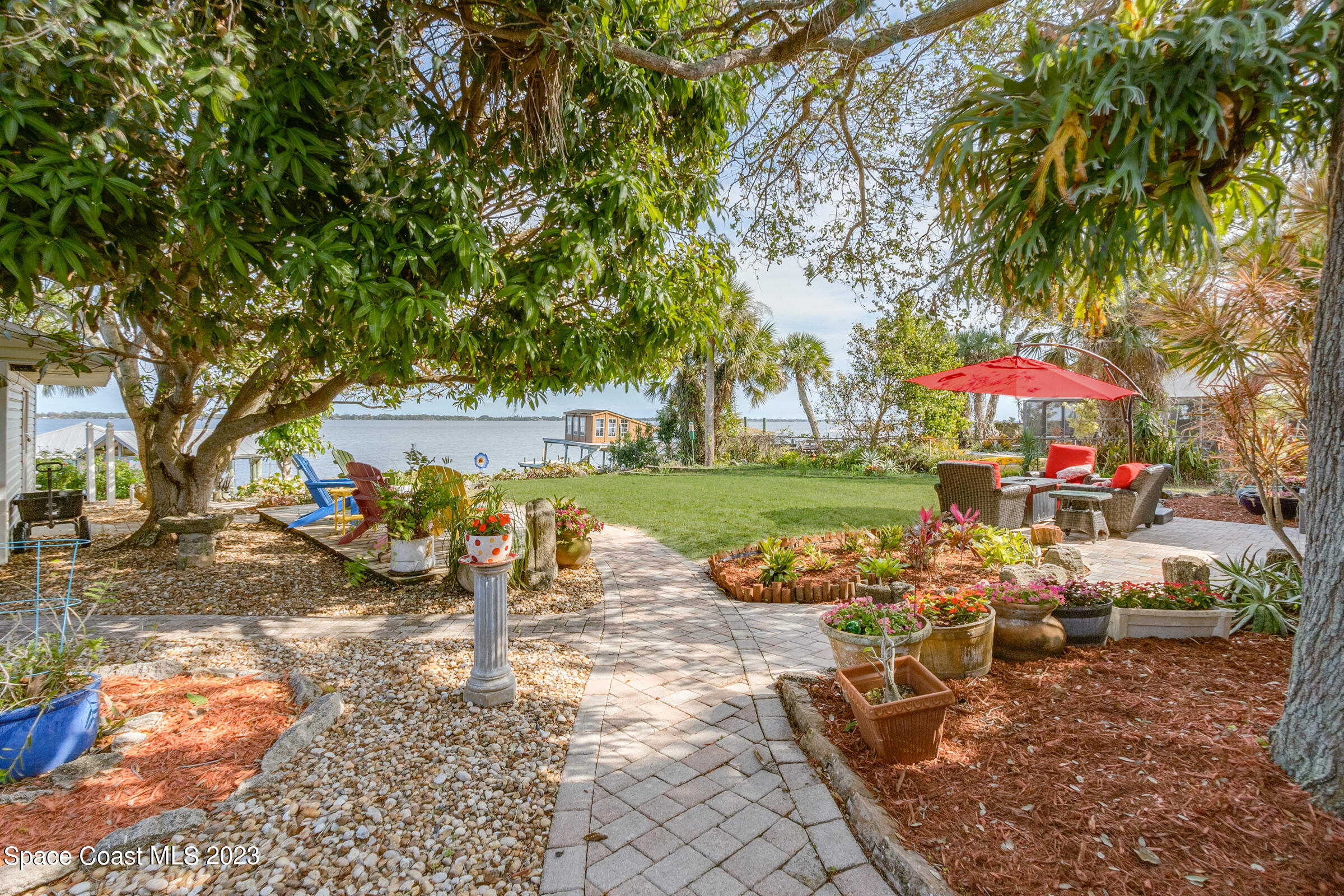 4553 Coquina Ridge Drive Melbourne, FL 32935 - Photo 34 of 51 an outdoor space with patio and lake view