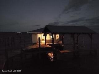 4553 Coquina Ridge Drive Melbourne, FL 32935 - Photo 4 of 51 a living room with furniture and a floor to ceiling window