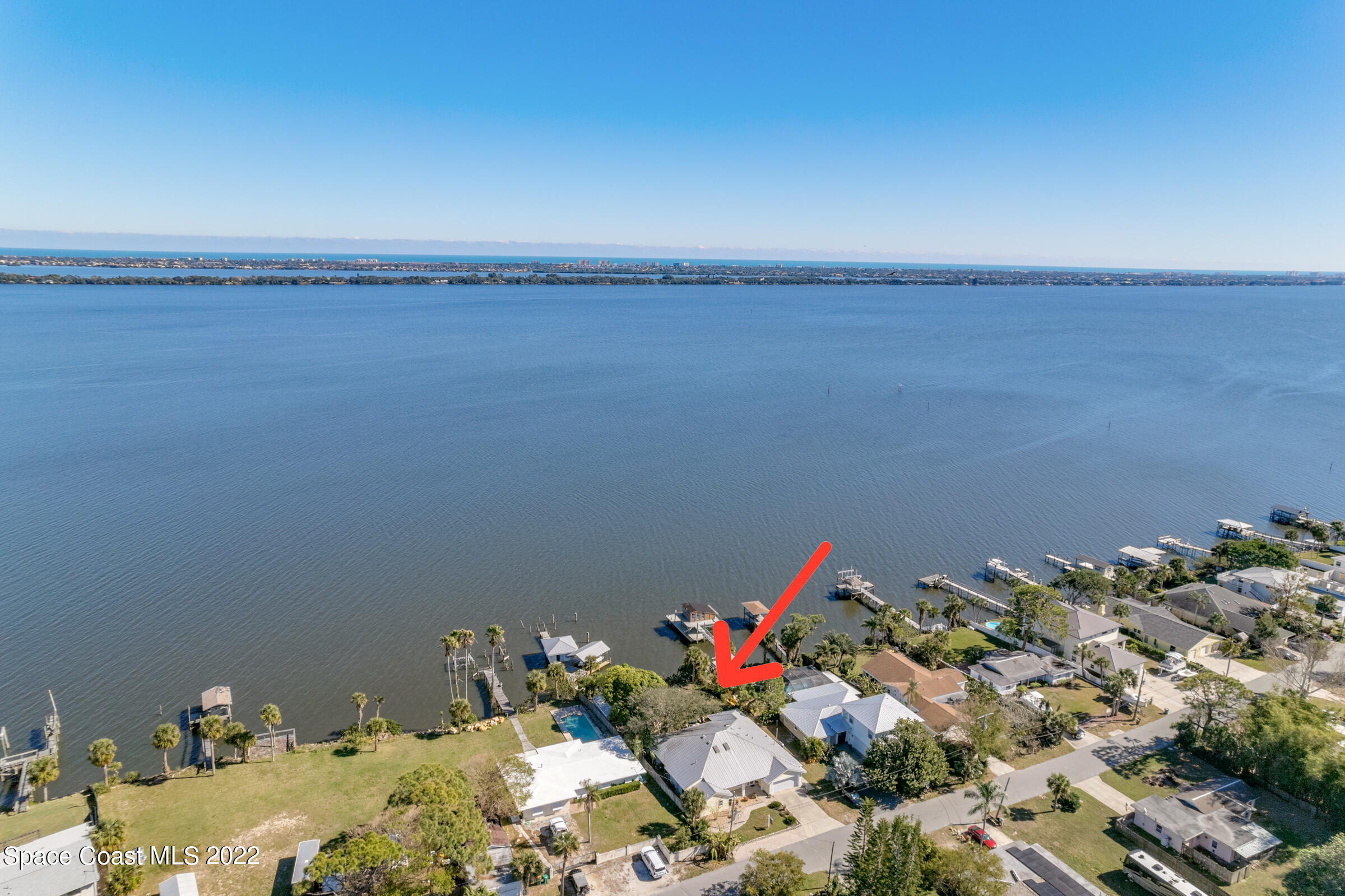 4553 Coquina Ridge Drive Melbourne, FL 32935 - Photo 49 of 51 a floor to a room with a wooden floor and shoes