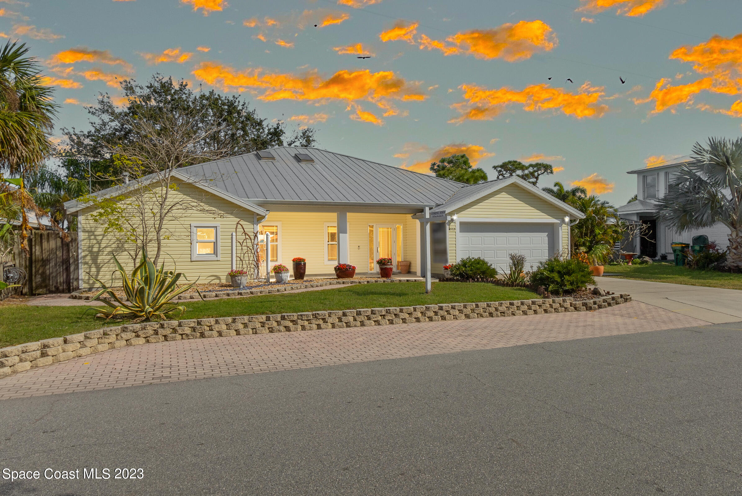 4553 Coquina Ridge Drive Melbourne, FL 32935 - Photo 5 of 51 a view of a house with a big yard and large tree