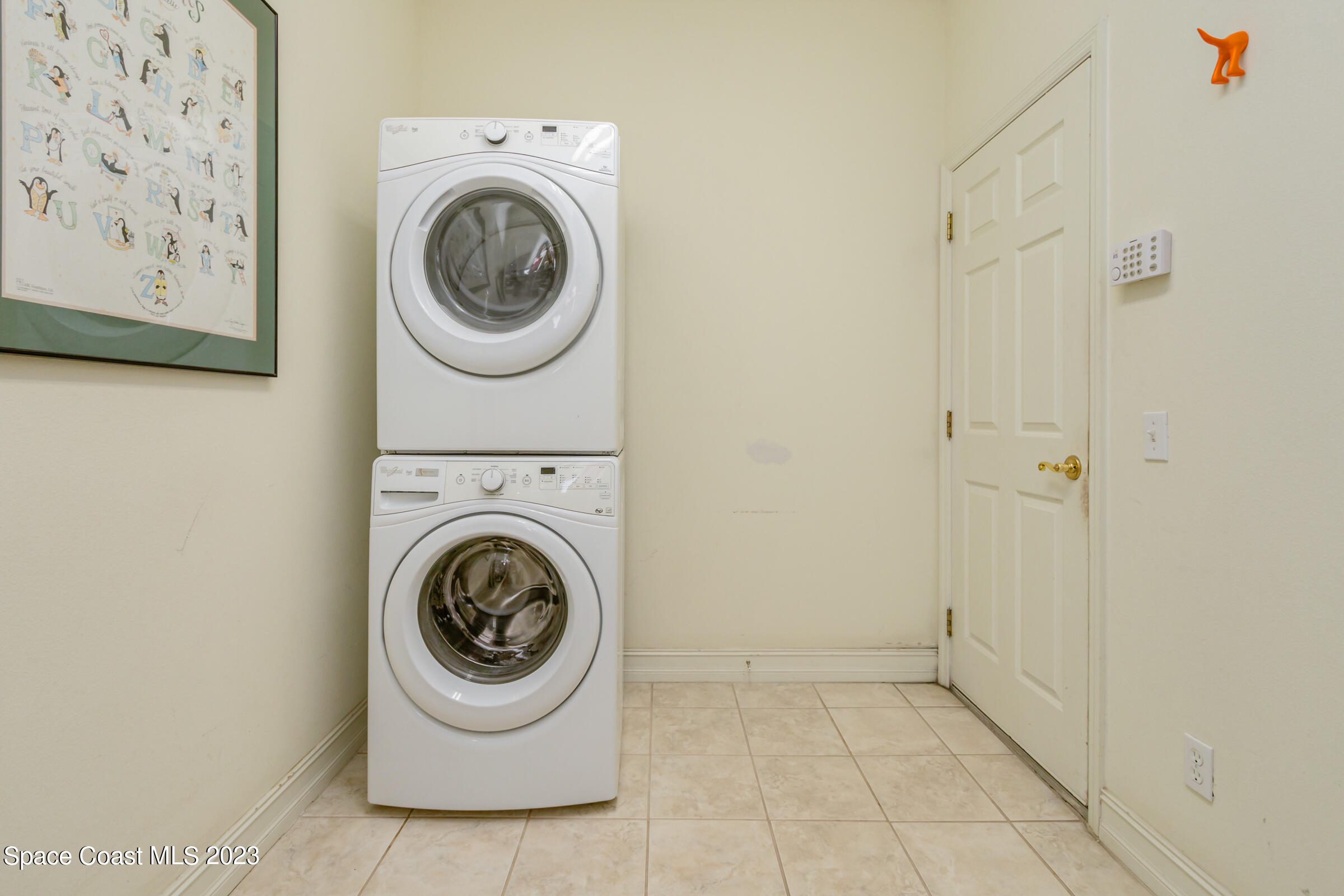 4553 Coquina Ridge Drive Melbourne, FL 32935 - Photo 51 of 51 a utility room with dryer and washer
