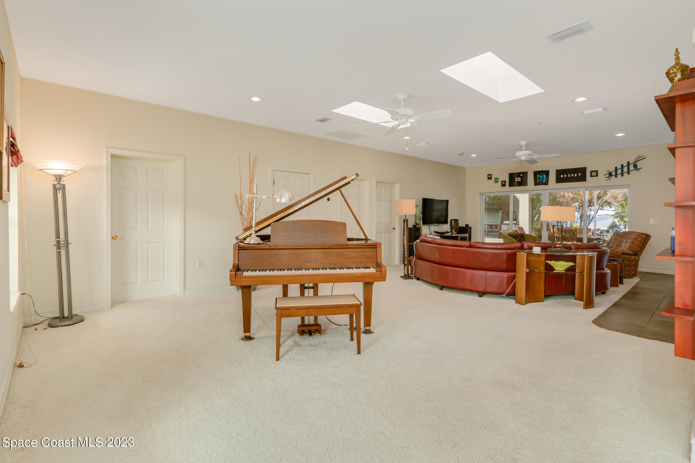 4553 Coquina Ridge Drive Melbourne, FL 32935 - Photo 9 of 51 a room with lots of furniture and air hockey table