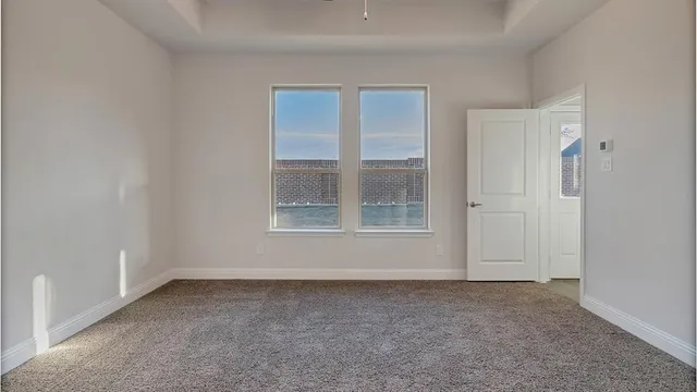 a view of an entryway with wooden floor and door
