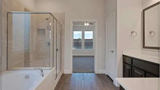 a view of an empty room with a kitchen