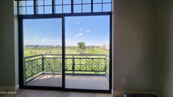 a view of a glass door with a balcony