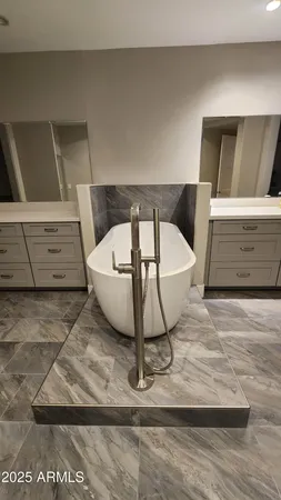 a white bath tub sitting in a room