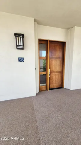 an empty room with closet and cabinet