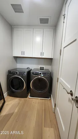 a utility room with sink washer and dryer
