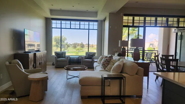 a living room with furniture and a large window