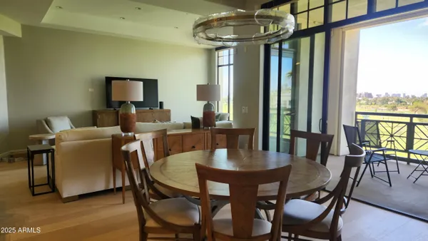 a view of a dining room with furniture window and outside view