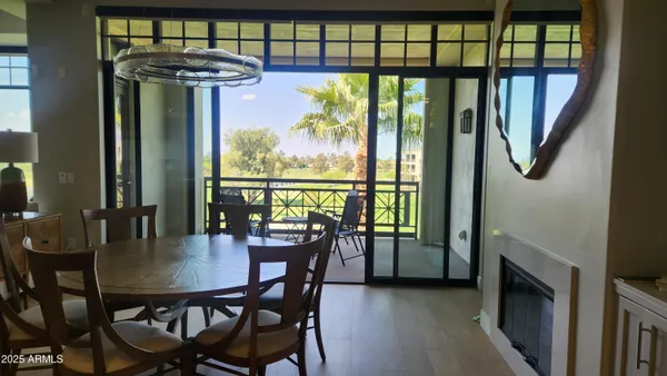 a view of a dining room with furniture window and outside view