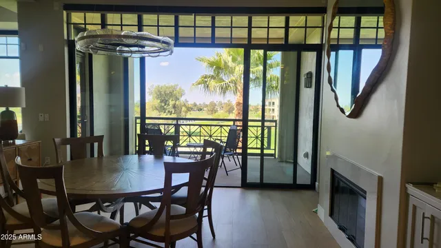 a view of a dining room with furniture window and outside view