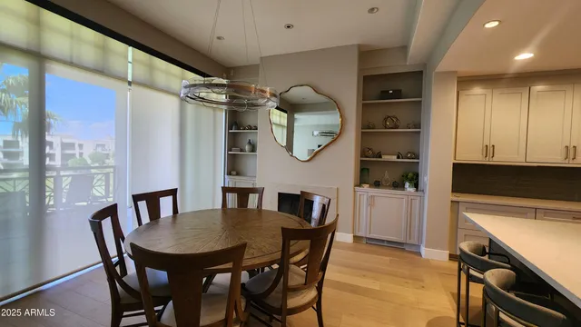 a view of a dining room and a table and chairs