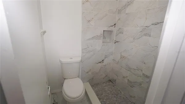 a kitchen with white cabinets and a sink