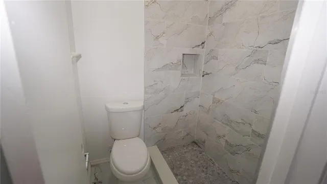 a kitchen with white cabinets and a sink