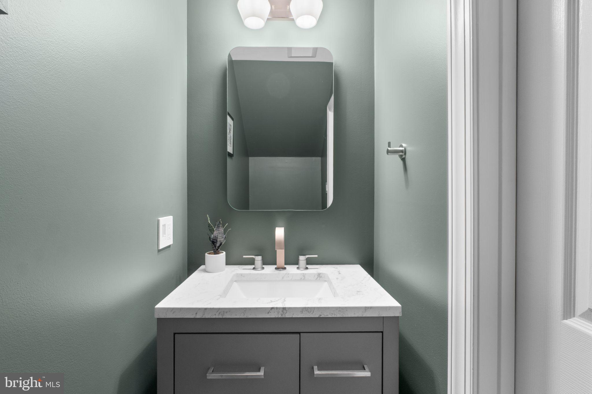 9504 Hyde Place Frederick, MD 21704 - Photo 13 of 43 a bathroom with a sink and a mirror