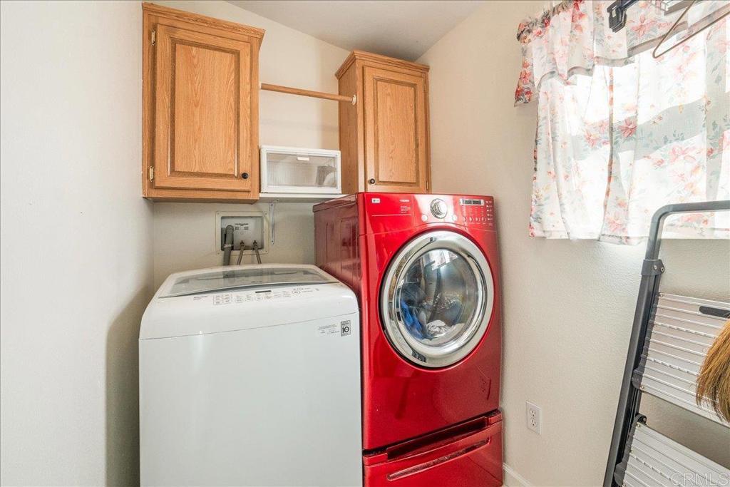 13941 Wisteria Avenue, Unit 53 Poway, CA 92064 - Photo 17 of 28 a utility room with dryer and washer