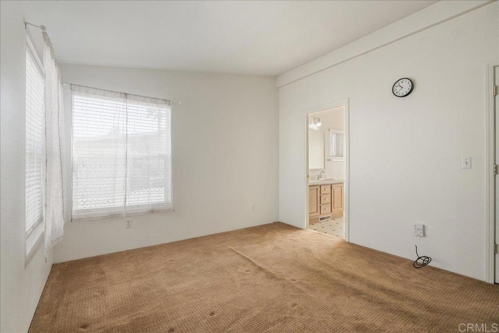 13941 Wisteria Avenue, Unit 53 Poway, CA 92064 - Photo 27 of 28 an empty room with windows
