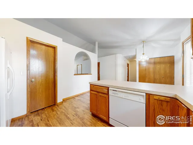 a open kitchen with sink and refrigerator
