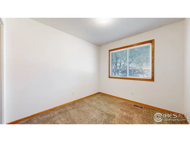 a bathroom with a sink a toilet a mirror and shower