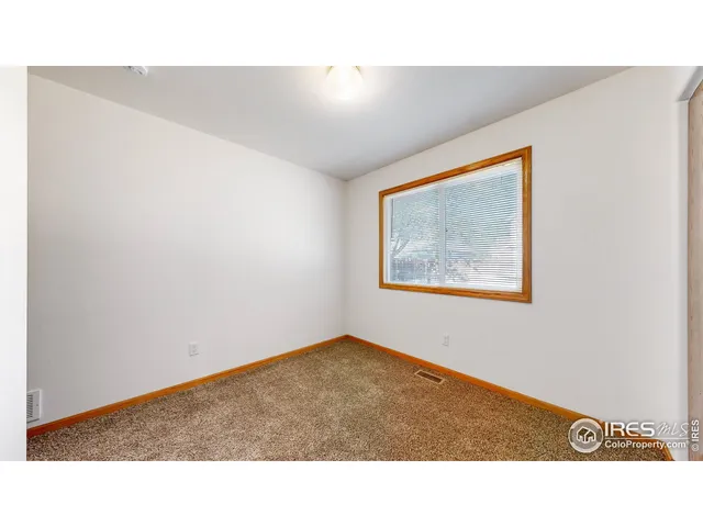 a open hall with a floor to ceiling window