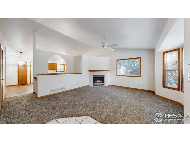 a living room with a couch and a window