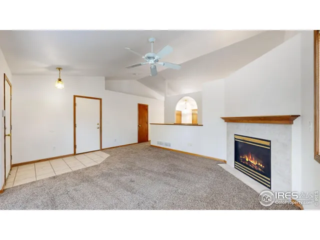 a open living room with furniture and a fireplace