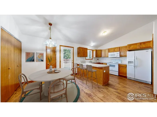 a kitchen with stainless steel appliances kitchen island granite countertop a sink and cabinets