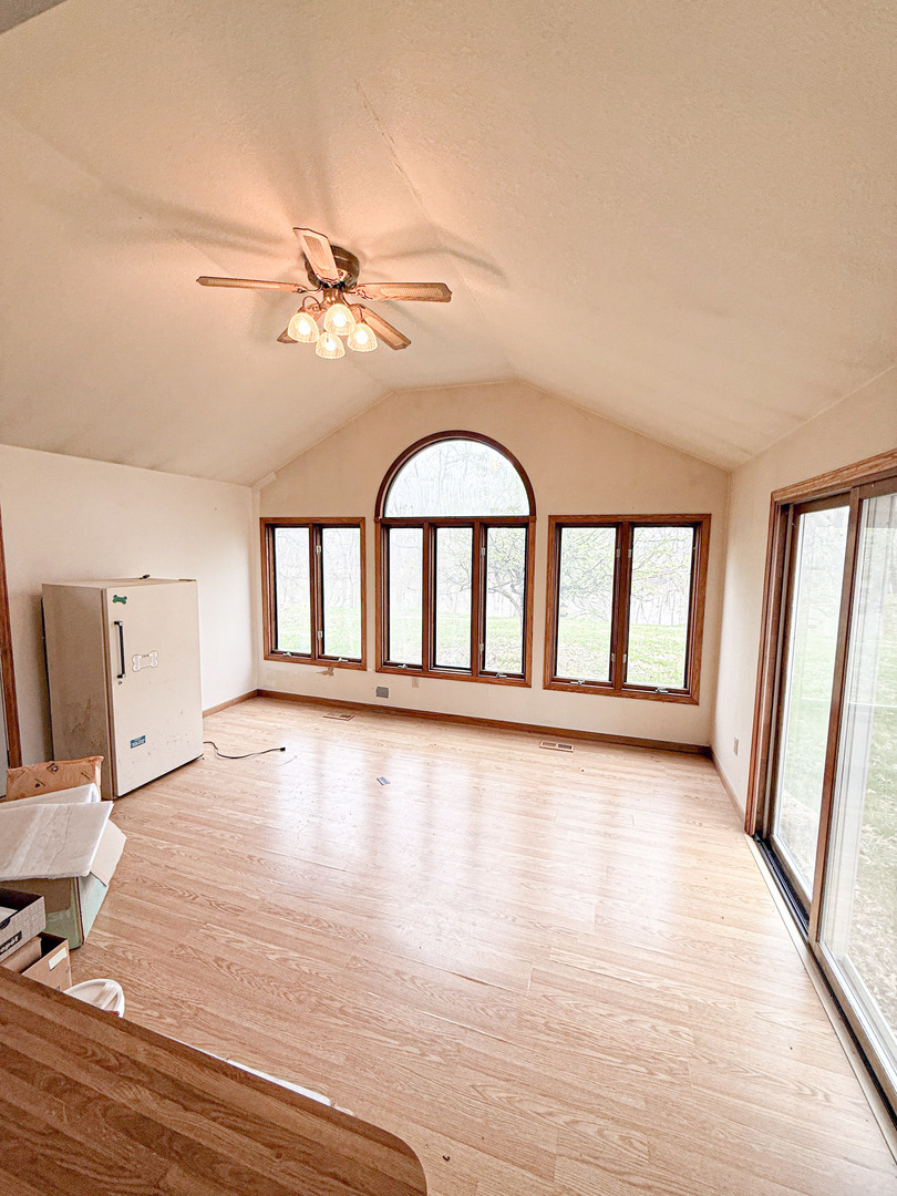 1599 East 2700 North Road Clifton, IL 60927 - Photo 10 of 26 wooden floor in an empty room with a window
