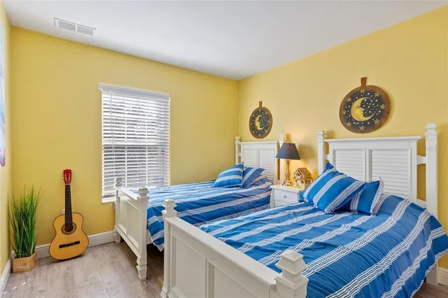 a bedroom with a bed and dresser