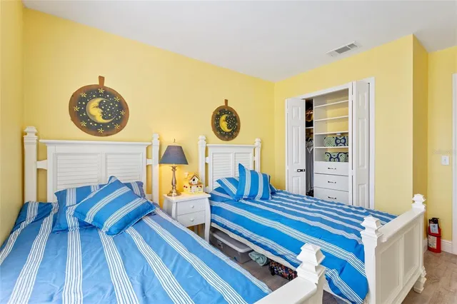 a bedroom with a bed and a dresser