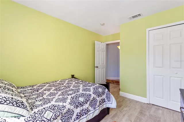 a bathroom with a sink mirror vanity and toilet