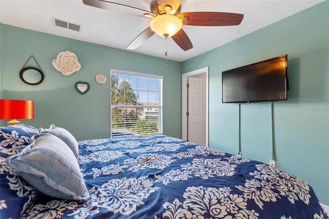 a bathroom with a toilet a sink and glass door